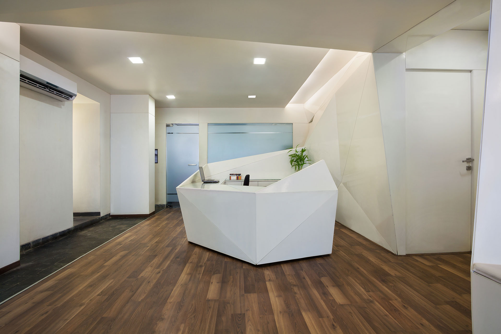 The main public space is surrounded by the various rooms that house the numerous functions that the clinic requires.